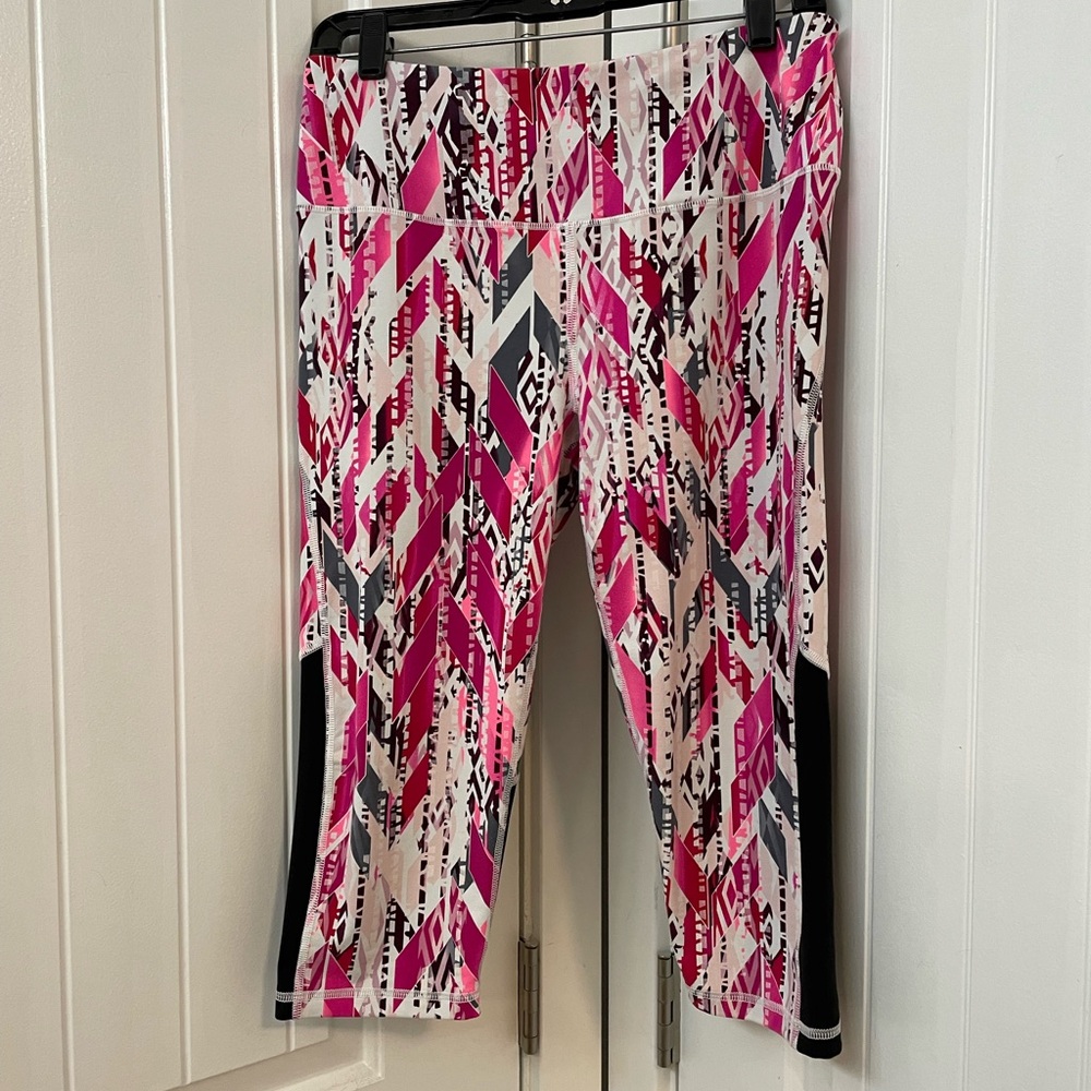 Victoria's Secret VSX Knockout vibrant Pink and Black Capri leggings.
